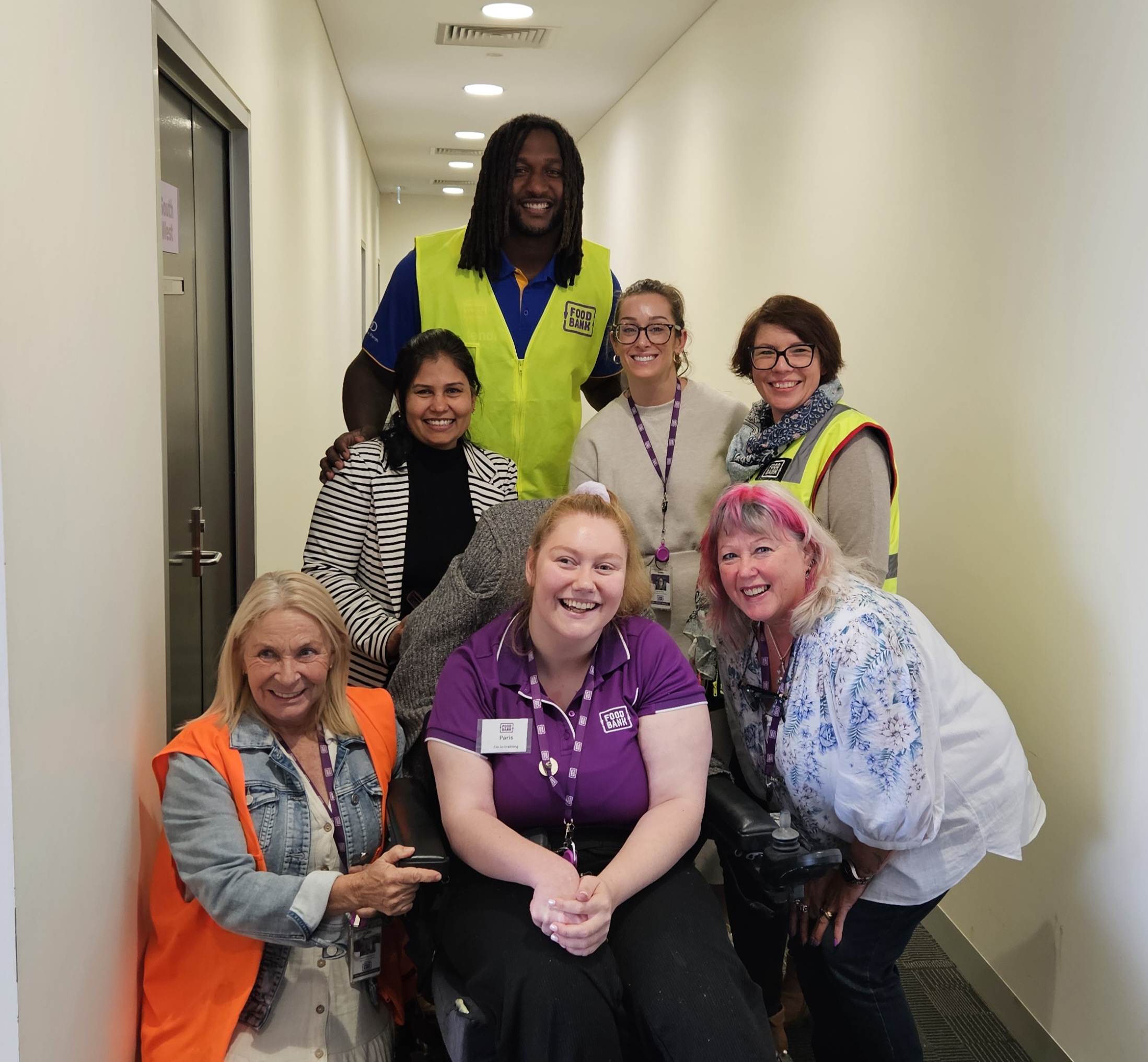 Paris with her Foodbank WA colleagues, Ability WA employment support coordinator and former Australian Rules Footballer, Nic Naitanui.